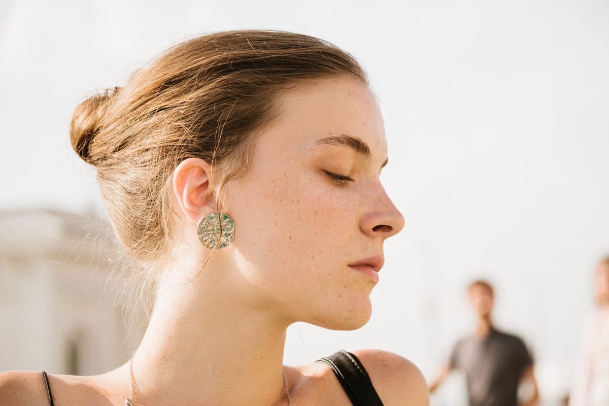 Profile of a young woman with closed eyes on a sunny day